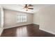 Spacious bedroom with hardwood floors, neutral paint, and a ceiling fan at 970 Timberview Rd, Clermont, FL 34715