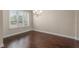 Bright dining room with window and dark hardwood floors at 970 Timberview Rd, Clermont, FL 34715