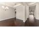 Elegant dining room with dark hardwood floors, chandelier, and tray ceiling at 970 Timberview Rd, Clermont, FL 34715