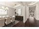 Elegant dining room featuring dark hardwood floors, neutral walls, chandelier, and dining set at 970 Timberview Rd, Clermont, FL 34715