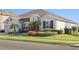 Well-maintained single-story home featuring manicured lawns and attractive landscaping at 970 Timberview Rd, Clermont, FL 34715