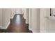 Hallway featuring dark wood floors, neutral walls, and white trim at 970 Timberview Rd, Clermont, FL 34715