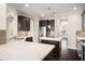 Spacious kitchen with quartz countertops, dark wood cabinets, and stainless steel appliances at 970 Timberview Rd, Clermont, FL 34715