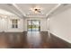 Spacious living room with hardwood floors, recessed lighting, and sliding glass doors at 970 Timberview Rd, Clermont, FL 34715