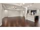 Spacious open-concept living room with hardwood floors connecting to the kitchen at 970 Timberview Rd, Clermont, FL 34715