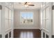 Office featuring French doors and window with plantation shutters at 970 Timberview Rd, Clermont, FL 34715