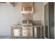 Close up of the stainless outdoor grill, sink and refrigerator at 970 Timberview Rd, Clermont, FL 34715