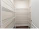 Walk-in pantry featuring wire shelving for optimal organization and storage at 970 Timberview Rd, Clermont, FL 34715