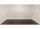 Empty walk-in closet featuring hardwood floors and wire shelving at 970 Timberview Rd, Clermont, FL 34715