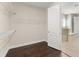 Walk-in closet with dark wood floors and ample shelving at 970 Timberview Rd, Clermont, FL 34715