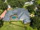 An aerial view showcasing the home's tile roof and screened-in pool area at 9907 Beaufort Ct, Windermere, FL 34786