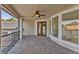 Outdoor balcony with brick floors, wrought iron railings and ceiling fan at 9907 Beaufort Ct, Windermere, FL 34786