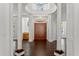 An expansive foyer with high ceilings, grand columns, and dark hardwood floors at 9907 Beaufort Ct, Windermere, FL 34786