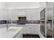 Well-equipped kitchen with stainless steel appliances, custom cabinetry, and a functional layout at 9907 Beaufort Ct, Windermere, FL 34786