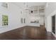 Open-concept living area with soaring ceilings and views into a modern kitchen at 9907 Beaufort Ct, Windermere, FL 34786