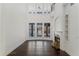Spacious living room with fireplace, tall windows, and an upstairs balcony at 9907 Beaufort Ct, Windermere, FL 34786