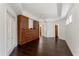 Spacious main bedroom with dark wood floors, custom wood cabinets and tray ceiling at 9907 Beaufort Ct, Windermere, FL 34786
