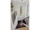Staircase with wood railings, carpet and natural light from large windows at 9907 Beaufort Ct, Windermere, FL 34786