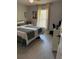 Comfortable bedroom with neutral tones, a bed and a well lit window view at 9978 Tivoli Villa Dr, Orlando, FL 32829