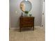 Entryway with wood dresser, mirror, and stylish decorations offering a warm welcome at 9978 Tivoli Villa Dr, Orlando, FL 32829