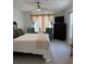 Bright main bedroom featuring neutral colors, comfortable seating, and ample natural light at 9978 Tivoli Villa Dr, Orlando, FL 32829