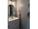 Cozy powder room featuring modern fixtures, vanity, and decor enhancing its appeal at 9978 Tivoli Villa Dr, Orlando, FL 32829