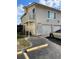 Two-story condo featuring an attached garage and private balcony, enhancing its curb appeal at 1001 Spring Meadow # 1001, Kissimmee, FL 34741