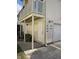 Corner exterior view of condo unit with outdoor balcony, siding, and private entrances at 1001 Spring Meadow # 1001, Kissimmee, FL 34741