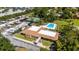 Aerial shot of community amenities, showcasing the clubhouse, pool, tennis courts and recreational vehicle parking at 10423 Manassas Cir, Orlando, FL 32821