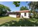 Home with large screened-in porch and mature trees surrounding the backyard at 10423 Manassas Cir, Orlando, FL 32821