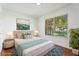 Cozy bedroom featuring a large window, area rug, and a comfortable queen bed at 10423 Manassas Cir, Orlando, FL 32821