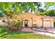 Charming single-story home featuring a front porch, well-maintained lawn, and a neutral exterior paint scheme at 10423 Manassas Cir, Orlando, FL 32821