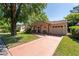 Charming single-story home with a terracotta tile roof, mature trees, and a spacious driveway at 10423 Manassas Cir, Orlando, FL 32821