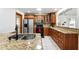 The kitchen features granite counters, wood cabinets, and stainless steel appliances at 10423 Manassas Cir, Orlando, FL 32821