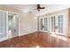 Living room with wood floors and French doors, providing a bright and airy space at 10423 Manassas Cir, Orlando, FL 32821
