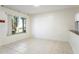Bright living room features large windows, neutral walls and ceramic tile flooring at 10423 Manassas Cir, Orlando, FL 32821