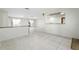 Open-concept living area with tile floors and access to an outdoor balcony at 10423 Manassas Cir, Orlando, FL 32821