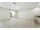 Bright living room features sliding glass doors, ceramic tile flooring, and natural light at 10423 Manassas Cir, Orlando, FL 32821