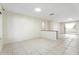Spacious living room with neutral walls, tile flooring, and natural light at 10423 Manassas Cir, Orlando, FL 32821