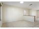 Bright, open living room with neutral tile flooring and ample natural light from a large window at 10423 Manassas Cir, Orlando, FL 32821