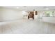 Spacious open-concept living area with tile floors and a breakfast bar at 10423 Manassas Cir, Orlando, FL 32821
