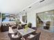 Covered patio with comfortable wicker furniture, perfect for outdoor dining and relaxation at 10423 Manassas Cir, Orlando, FL 32821