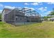 Screened-in pool and backyard area, offering both privacy and scenic views of the property at 10435 Eastpark Lake Dr, Orlando, FL 32832