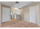 Spacious upstairs hallway with neutral paint, leading to various rooms of the home at 10435 Eastpark Lake Dr, Orlando, FL 32832