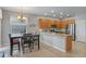 Well-appointed kitchen with stainless appliances, granite counters, and adjacent dining area at 10435 Eastpark Lake Dr, Orlando, FL 32832