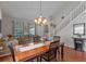 Stylish living room and dining area with high ceilings and staircase at 10435 Eastpark Lake Dr, Orlando, FL 32832
