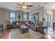 Cozy living room featuring a comfortable sectional couch and neutral decor at 10435 Eastpark Lake Dr, Orlando, FL 32832