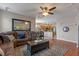 Comfortable living room offering a view of the open kitchen and dining area at 10435 Eastpark Lake Dr, Orlando, FL 32832