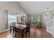 Bright and airy living room showcasing an open floor plan with dining area and comfortable seating at 10435 Eastpark Lake Dr, Orlando, FL 32832