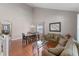 Spacious living room featuring high ceilings, wood floors, and large windows at 10435 Eastpark Lake Dr, Orlando, FL 32832